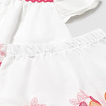 Completo con bermuda e blusa ricamata neonata 