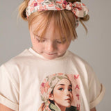 Maglietta con elastico per capelli stampato bambina 